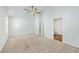 Cozy bedroom with soft carpet, ceiling fan, and ensuite bathroom entrance at 166 Rosefield Ct, Summerville, SC 29485