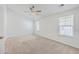 Bright bedroom with carpet, two windows, and a ceiling fan at 166 Rosefield Ct, Summerville, SC 29485