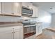 Close up on stainless steel oven and microwave, cabinets, and countertop at 166 Rosefield Ct, Summerville, SC 29485