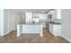 Bright kitchen features stainless steel appliances, white cabinets, and an island at 166 Rosefield Ct, Summerville, SC 29485