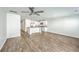 Open-concept living space showcasing a modern kitchen with white cabinets and hardwood floors at 166 Rosefield Ct, Summerville, SC 29485