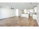 Open-concept living room and kitchen area with stainless steel appliances and wood flooring at 166 Rosefield Ct, Summerville, SC 29485