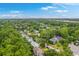 An aerial picture shows a neighborhood with mature landscaping, homes, and a view of the city skyline at 1972 Gray Battery Ct, Mount Pleasant, SC 29464