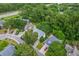 From above, view the many houses nestled in a community with mature trees, and neatly manicured lawns at 1972 Gray Battery Ct, Mount Pleasant, SC 29464
