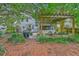 Lush backyard showcasing an outdoor pergola, BBQ grill, patio furniture, and a well-maintained lawn at 1972 Gray Battery Ct, Mount Pleasant, SC 29464