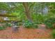 Landscaped backyard with a pergola, patio furniture, and a thriving hydrangea bush at 1972 Gray Battery Ct, Mount Pleasant, SC 29464