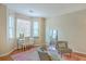 Bright bedroom with large windows, hardwood floors, and chic furnishings, creating a cozy and inviting space at 1972 Gray Battery Ct, Mount Pleasant, SC 29464