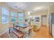 Bright dining area boasting hardwood floors, an elegant chandelier, and large windows at 1972 Gray Battery Ct, Mount Pleasant, SC 29464