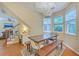 Dining area in view of the living room with hardwood floors and view to outside at 1972 Gray Battery Ct, Mount Pleasant, SC 29464