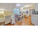 Charming dining area featuring hardwood floors, a modern light fixture, and plenty of natural light at 1972 Gray Battery Ct, Mount Pleasant, SC 29464