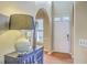 Bright foyer with archway, decor shelving, and light hardwood floors, offering a warm welcome into the home at 1972 Gray Battery Ct, Mount Pleasant, SC 29464