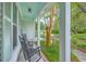 Cozy covered porch with rocking chairs, offering a relaxing outdoor space, accented by plants and a view at 1972 Gray Battery Ct, Mount Pleasant, SC 29464
