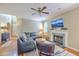 Comfortable living room area with fireplace and mounted television; perfect spot to unwind and relax at 1972 Gray Battery Ct, Mount Pleasant, SC 29464