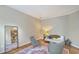 Comfortable living room with hardwood floors, full-length mirror, and stylish seating, offering a relaxing atmosphere at 1972 Gray Battery Ct, Mount Pleasant, SC 29464