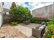 Charming backyard patio with outdoor seating and lush greenery, ideal for relaxation and entertaining at 2 Bedons Aly, Charleston, SC 29401