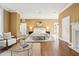 Large bedroom with sitting area and fireplace, bathed in natural light at 2 Bedons Aly, Charleston, SC 29401