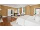 Spacious bedroom with sitting area, hardwood floors, and bright, natural light at 2 Bedons Aly, Charleston, SC 29401