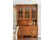 Wooden built-in hutch with glass doors and display cabinet near the kitchen area at 2 Bedons Aly, Charleston, SC 29401