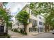 Charming exterior view of an elegant building showcasing historic architecture and verdant trees at 2 Bedons Aly, Charleston, SC 29401