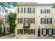 Beautiful exterior view of a classic townhouse, showcasing traditional architecture and a charming street presence at 2 Bedons Aly, Charleston, SC 29401
