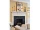 Fireplace with white mantle and built-in shelves featuring elegant decor at 2 Bedons Aly, Charleston, SC 29401