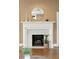 White mantel and marble fireplace adding charm to the living area at 2 Bedons Aly, Charleston, SC 29401