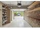 Spacious garage with shelving, brick walls, and access to the backyard at 2 Bedons Aly, Charleston, SC 29401