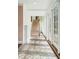 Bright hallway featuring brick floors and multiple glass doors leading to the outside at 2 Bedons Aly, Charleston, SC 29401
