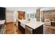 Spacious kitchen features a large island, farmhouse sink, and stainless steel appliances at 2 Bedons Aly, Charleston, SC 29401
