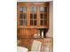 Custom wood cabinetry featuring glass-fronted doors and open shelving to display kitchen essentials and decor at 2 Bedons Aly, Charleston, SC 29401