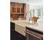 Close up of the island with large sink, chrome faucet, and white countertop at 2 Bedons Aly, Charleston, SC 29401