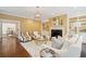 Cozy living room with neutral furnishings, a fireplace, and built-in shelving at 2 Bedons Aly, Charleston, SC 29401