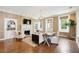 Bright living room featuring hardwood floors, a fireplace, and multiple windows for ample natural light at 2 Bedons Aly, Charleston, SC 29401
