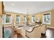 Bright living room with hardwood floors, neutral furnishings, and large windows at 2 Bedons Aly, Charleston, SC 29401