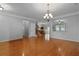 Spacious living room with hardwood floors, elegant chandelier, and an open floor plan at 200 Commencement Blvd, Ladson, SC 29456