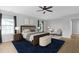 Relaxing main bedroom featuring a large bed, a seating area, and soft, neutral tones at 200 Commencement Blvd, Ladson, SC 29456