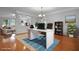 Bright home office with hardwood floors, area rug, chandelier lighting and lots of natural light at 200 Commencement Blvd, Ladson, SC 29456
