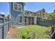 View of the backyard with blue siding on the house at 2036 Kings Gate Ln, Mount Pleasant, SC 29466