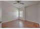 Cozy bedroom with hardwood floors, ceiling fan and white shutters allowing lots of natural light at 2036 Kings Gate Ln, Mount Pleasant, SC 29466