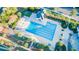 Bright aerial shot of community pool with lap lanes, pergola, bath house, and lounge chairs at 2036 Kings Gate Ln, Mount Pleasant, SC 29466