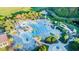 A large community pool with twisting slide is surrounded by palm trees and lush landscaping at 2036 Kings Gate Ln, Mount Pleasant, SC 29466