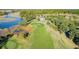 Scenic aerial view of a lush golf course with waterway and clubhouse in the background at 2036 Kings Gate Ln, Mount Pleasant, SC 29466