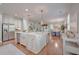 Spacious open-concept kitchen featuring a large marble island, stainless steel appliances, and hardwood floors at 2036 Kings Gate Ln, Mount Pleasant, SC 29466