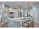 Bright kitchen featuring a marble island with seating, stainless steel appliances, and custom cabinetry at 2036 Kings Gate Ln, Mount Pleasant, SC 29466