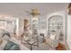Inviting living room with a fireplace, built-in shelves, and a view of the staircase at 2036 Kings Gate Ln, Mount Pleasant, SC 29466