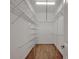 Walk-in closet with wooden floors and wire shelving for optimal organization at 2036 Kings Gate Ln, Mount Pleasant, SC 29466