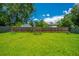 Lush green backyard with tall trees and privacy fence at 207 Apache Dr, Summerville, SC 29483