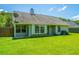 Backyard view showcasing lush lawn, privacy fence, and the house at 207 Apache Dr, Summerville, SC 29483
