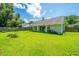 Manicured lawn of a backyard with privacy fence, and house in the background at 207 Apache Dr, Summerville, SC 29483