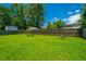 Spacious backyard featuring lush green grass and a privacy fence at 207 Apache Dr, Summerville, SC 29483